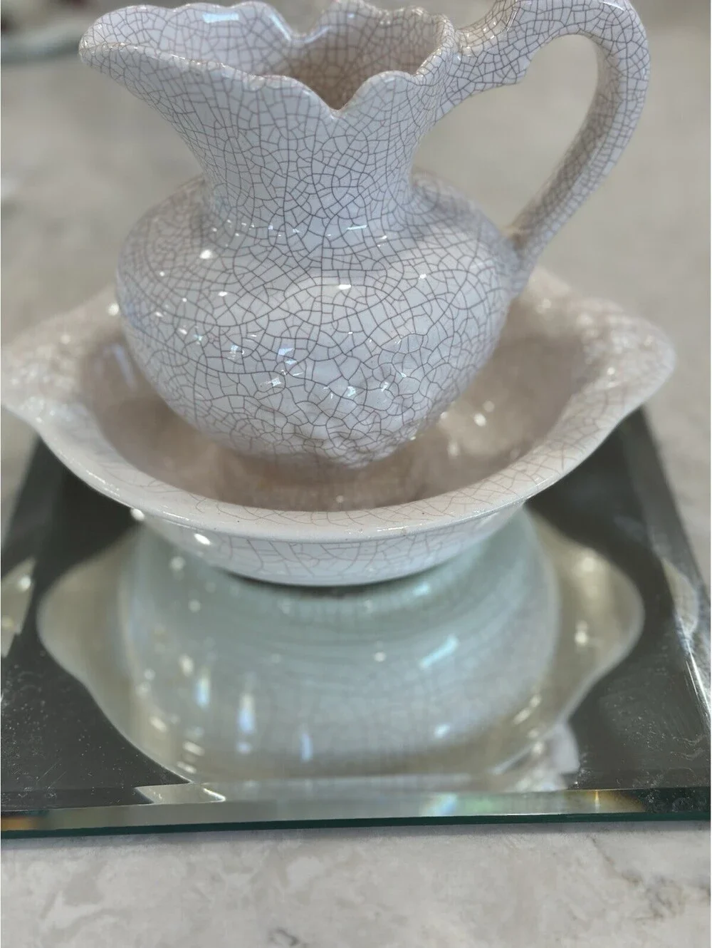 Farmhouse-style pitcher and basin set, featuring a distinct white crackle finish